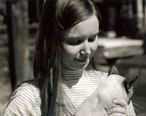 A picture of my mom in her early twenties with her cat
