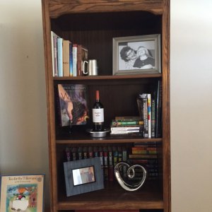 This is me. This is me decorating with books. This is me decorating my living room via a bookshelf.