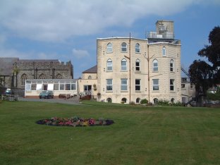 four story white brick building