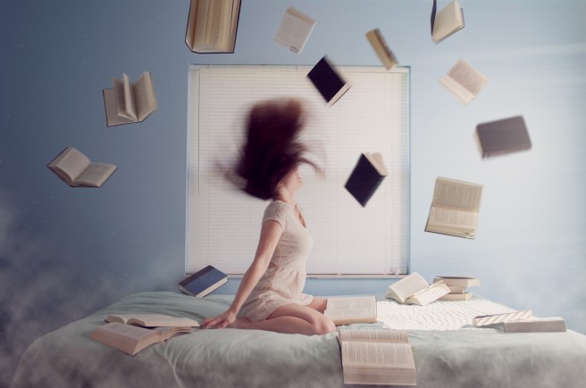 Woman surrounded by flying books