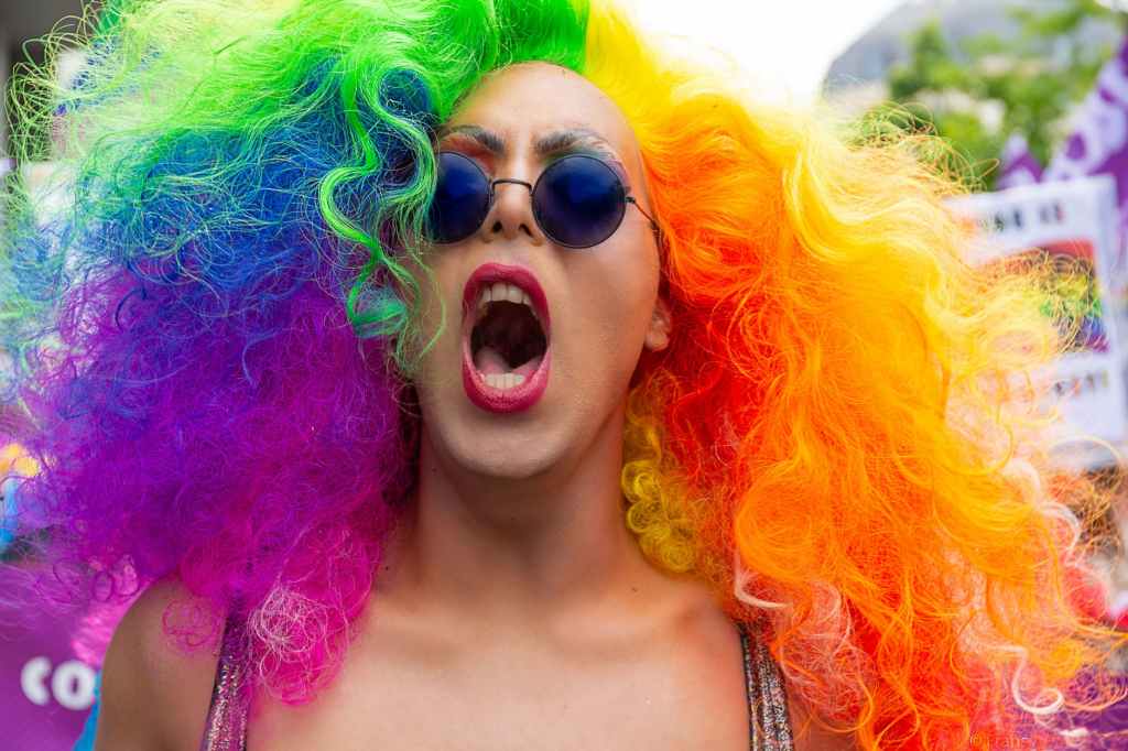a man in a rainbow wig