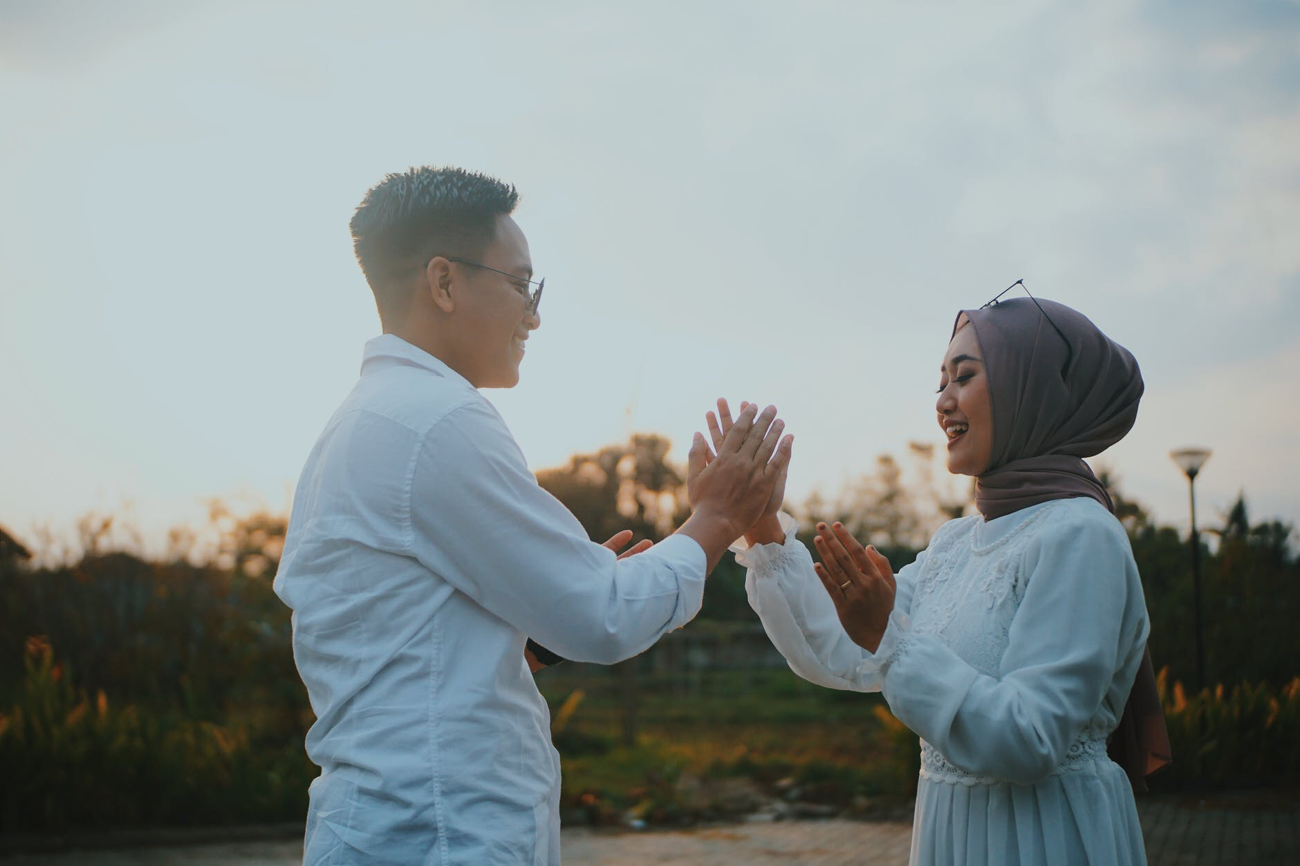 Muslim couple clapping hands