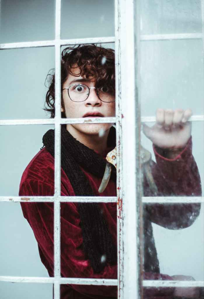 Young man looking horrified