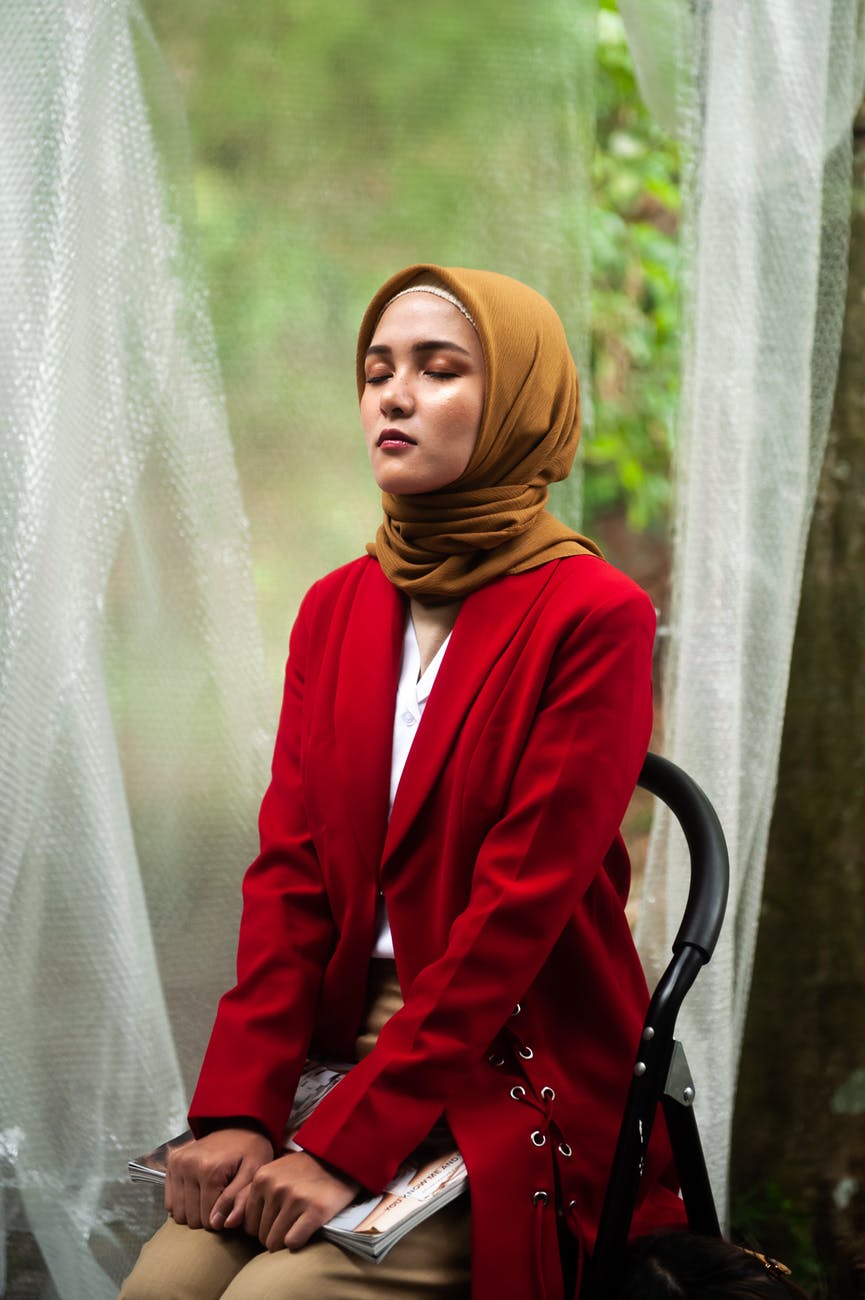 Meditating woman in a hijab