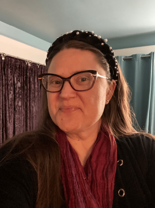 smiling woman in a black headband